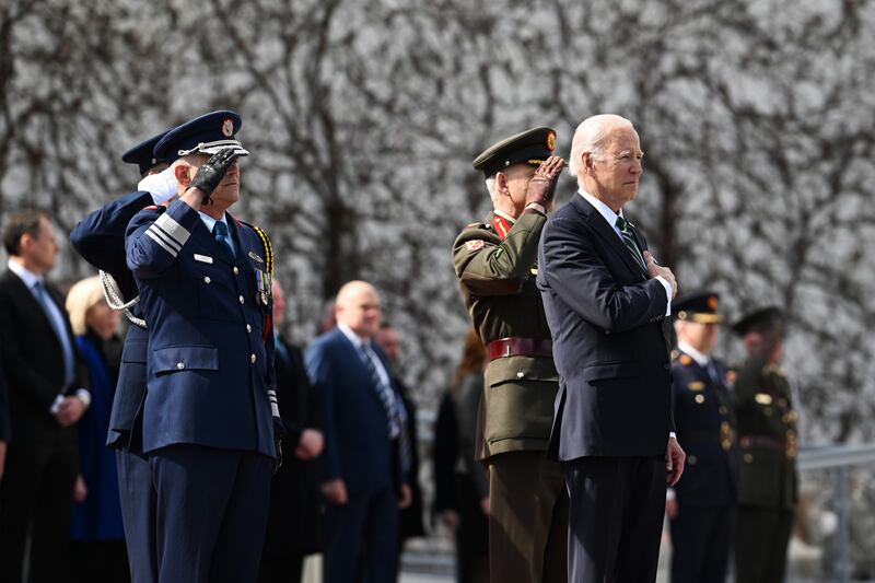 Mr Biden stands for the US national anthem at the Irish President's official residence Aras an Uachtarain in Dublin. Getty
