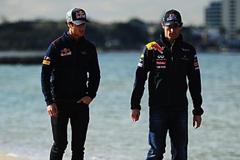 Daniel Ricciardo, left, walks with his Australian compatriot and Red Bull driver Mark Webber on St Kilda beach in Melbourne. Ricciardo will be Toro Rosso's reserve driver this season.