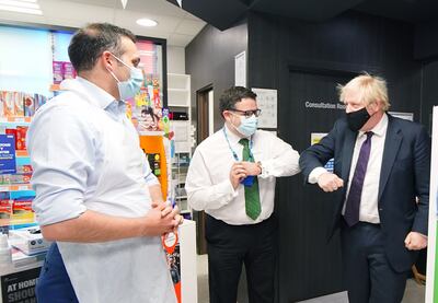 Prime Minister Boris Johnson meets staff during a visit to a pharmacy in the North Shropshire constituency on December 3. He has since kept away from the area amid the fallout from the Christmas party saga and a Tory rebellion over his Plan B Covid measures. PA