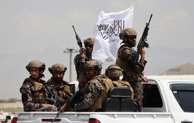 Taliban fighters at Hamid Karzai International Airport after the departure of foreign troops. EPA