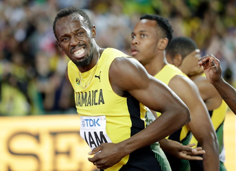 Jamaica's Usain Bolt grimaces after injuring himself during the men's 4x100m final at the World Athletics Championships in London Saturday, Aug. 12, 2017. (AP Photo/Matthias Schrader)