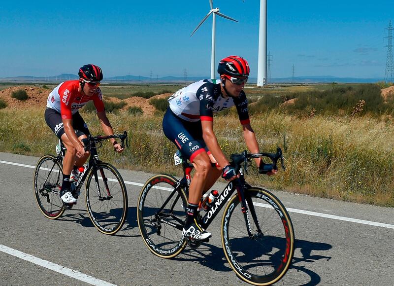 Lotto Soudal's Belgian cyclist Jelle Wallays (L) and UAE Team Emirates' Norwegian cyclist Sven Erik Bystrom ride ahead of the pack during the 18th stage of the 73rd edition of "La Vuelta" Tour of Spain cycling race, a 186.1 km flat route from Egea de los Caballeros to Lleida, on September 13, 2018. / AFP / ANDER GILLENEA

