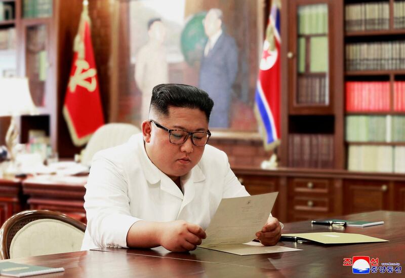 In this undated photo provided on Sunday, June 23, 2019, by the North Korean government, North Korean leader Kim Jong Un reads a letter from U.S. President Donald Trump. Independent journalists were not given access to cover the event depicted in this image distributed by the North Korean government. The content of this image is as provided and cannot be independently verified. Korean language watermark on image as provided by source reads: "KCNA" which is the abbreviation for Korean Central News Agency. (Korean Central News Agency/Korea News Service via AP)