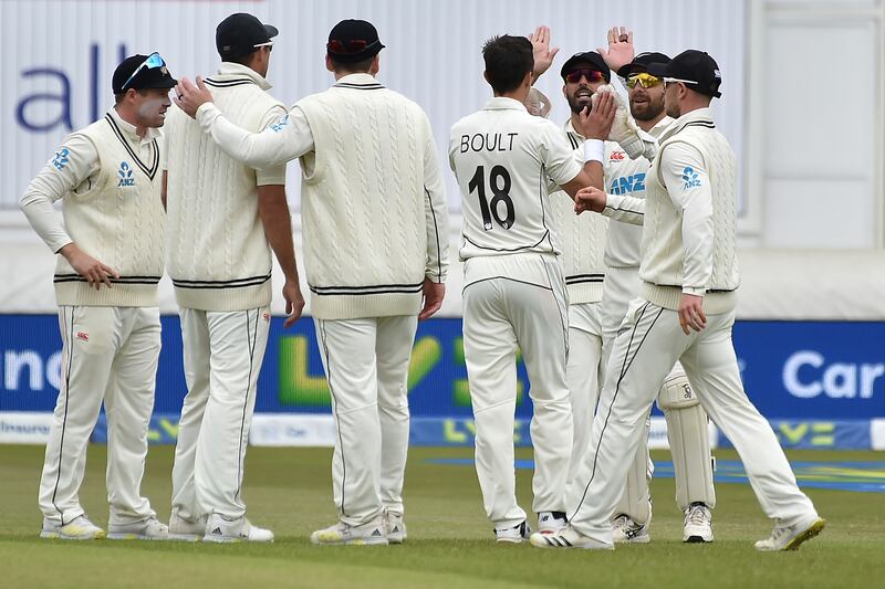 New Zealand bowler Trent Boult celebrates with teammates after the dismissal of England's Joe Root. AP