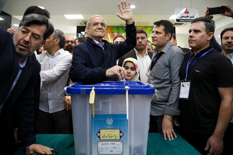 Reformist candidate Masoud Pezeshkian casts his ballot in the Iranian presidential election, in Tehran. AP Photo