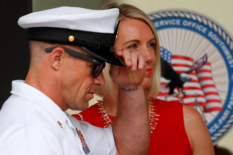 U.S. Navy SEAL Special Operations Chief Edward Gallagher leaves court with his wife Andrea, her name tattooed on his wrist, after the first day of jury selection at this court-martial trial at Naval Base San Diego in San Diego, California , U.S., June 17, 2019.    REUTERS/Mike Blake     TPX IMAGES OF THE DAY