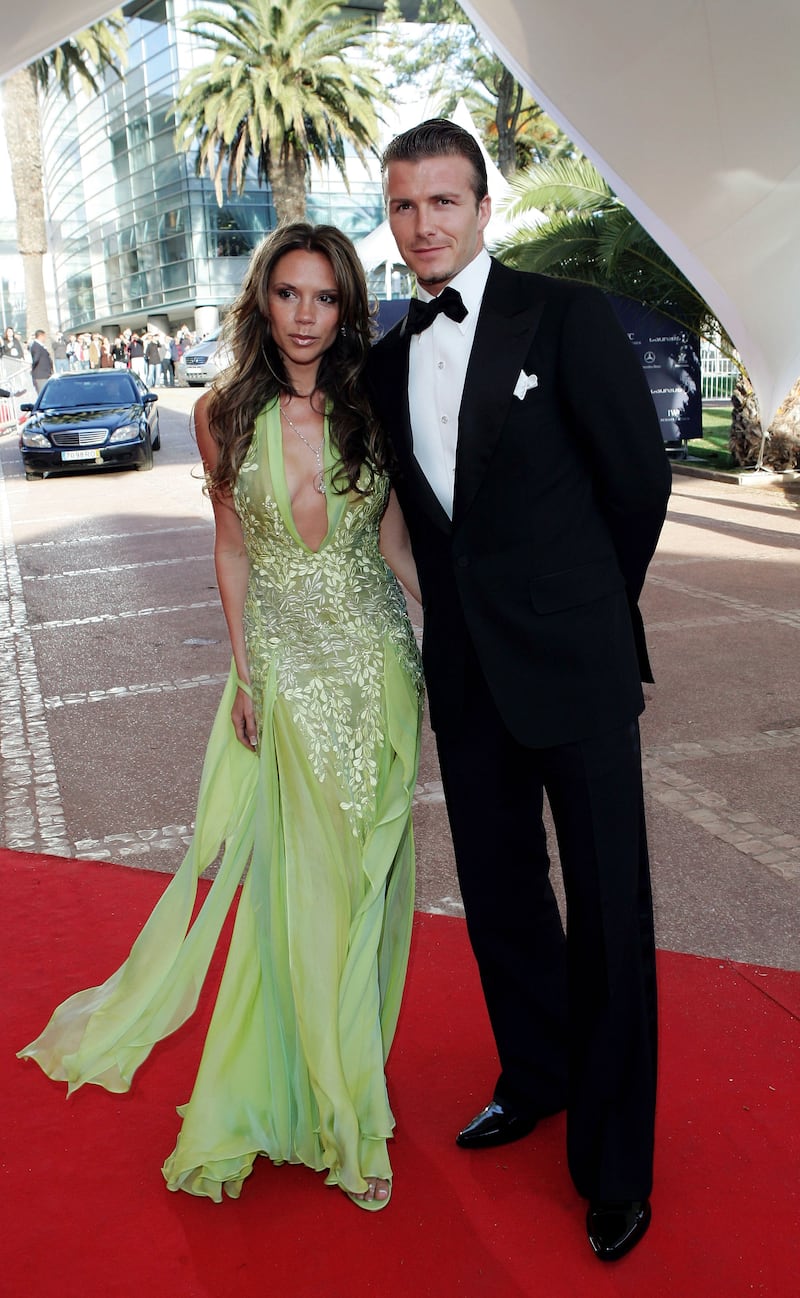 ESTORIL, PORTUGAL - MAY 16:  David and Victoria Beckham arrive at the Laureus World Sports Awards May 16, 2005 at the Estoril Casino, Estoril, Portugal.  (Photo by MJ Kim/Getty Images for Laureus)