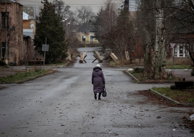 A resident of Bakhmut walks along an empty street. Reuters
