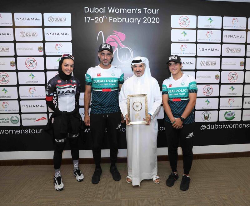 UAE cyclist Safia Al Sayegh, left, Secretary General of Dubai Sports Council Saeed Mohammed Hareb, right, and members of the Dubai Police amateur cycling team at the press conference for the Dubai Women's Tour. Courtesy Dubai Women's Tour