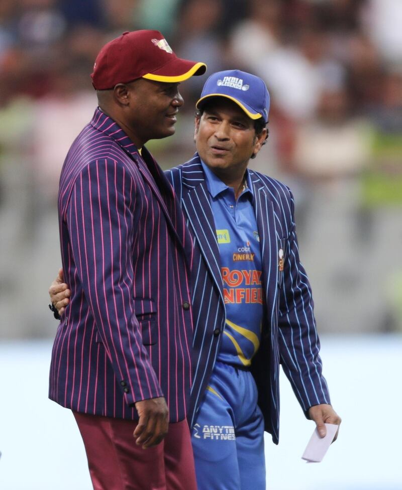 West Indies Legends' Brian Lara and India Legends' Sachin Tendulkar walks during a toss ahead of the start of the Road Safety World Series cricket match in Mumbai, India, Saturday, March 7, 2020. (AP Photo/Rajanish Kakade)