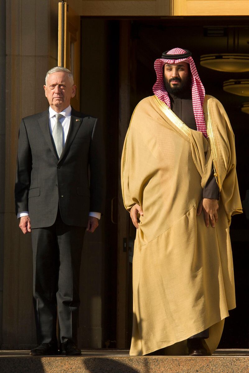 Defense Secretary Jim Mattis, left, and Saudi Crown Prince Mohammed bin Salman stand for the playing of the Saudi Arabia national anthem as Mattis welcomes the Crown Prince to the Pentagon in Washington, Thursday, March 22, 2018. (AP Photo/Cliff Owen)