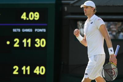 Kevin Anderson of South Africa celebrates winning his men's quarterfinals match against Switzerland's Roger Federer, at the Wimbledon Tennis Championships, in London, Wednesday July 11, 2018. (AP Photo/Ben Curtis)