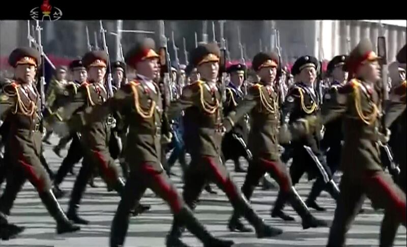 In this image made from video released by KRT,  North Korean soldiers march during a military parade in Pyongyang. KRT / AP