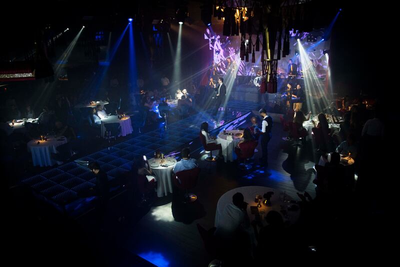 An artist performs at The Theater at Fairmont Dubai.