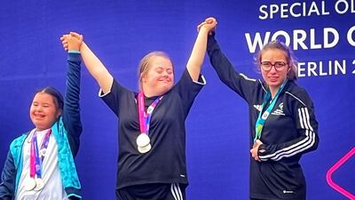 Ruby Hamilton, 17, centre, who has Down Syndrome and autism, won three medals in gymnastics at the World Games in June