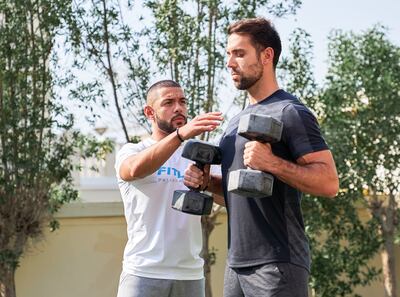 Alberto Pardo, co-founder and chief executive of Fitlov with a personal trainer. Photo: Fitlov