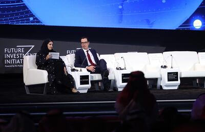 Steven Mnuchin, U.S. treasury secretary, center, speaks with Sarah Al-Suhaimi, chairwoman of the Saudi Stock Exchange (Tadawul), on day two of the Future Investment Initiative (FII) forum at the Ritz Carlton hotel in Riyadh, Saudi Arabia, on Wednesday, Oct. 30, 2019. Crown Prince Mohammed bin Salman will determine the timing of oil giant Saudi Aramco’s long-anticipated share sale, according to the kingdom’s energy minister. Photographer: Faisal Al Nasser/Bloomberg
