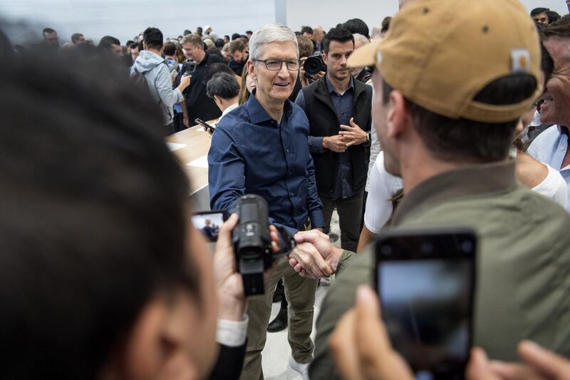 Tim Cook mingles with attendees. David Paul Morris / Bloomberg