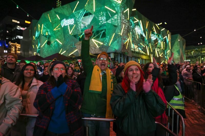 Australia fans celebrate at Melbourne's Federation Square after the Matildas scored their second goal against Denmark. Getty