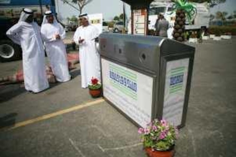 United Arab Emirates - Abu Dhabi - March 1st, 2009:  A new recycling bin that uses on solar power to light up advertising space will soon be places along the Corniche.  (Galen Clarke/The National) For story by Matt Kwong *** Local Caption ***  GC10_03012009_RecycleBin.jpg