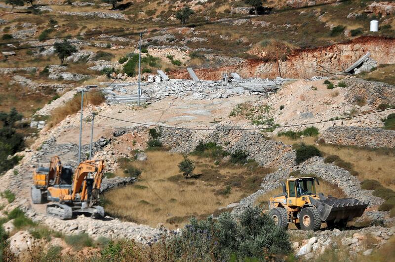 Israeli machineries are seen after demolishing a Palestinian house under construction, in Beitunia in the Israeli-occupied West Bank, June 24, 2020. REUTERS/Mohamad Torokman