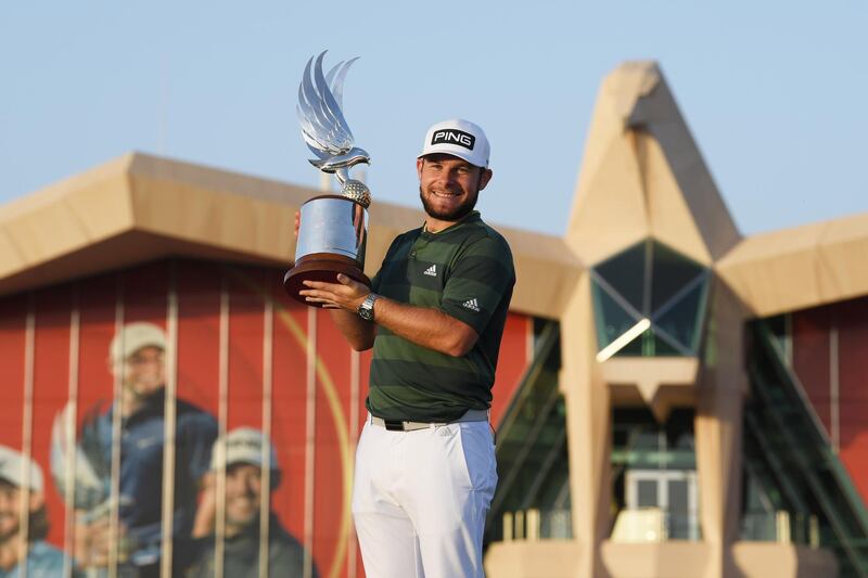 ABU DHABI, UNITED ARAB EMIRATES - JANUARY 24: Tyrrell Hatton of England celebrates with the trophy following victory during Day 4 of the Abu Dhabi HSBC Championship at Abu Dhabi Golf Club on January 24, 2021 in Abu Dhabi, United Arab Emirates. (Photo by Ross Kinnaird/Getty Images)