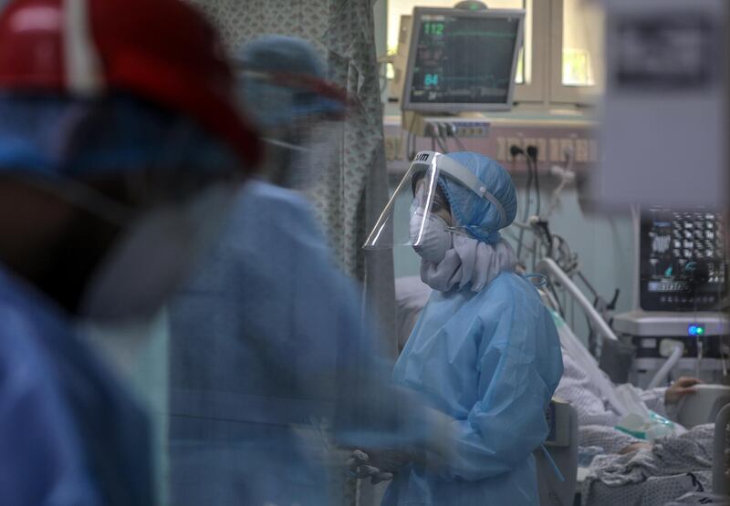 Members of the clinical staff wearing Personal Protective Equipment (PPE) care for a patient with coronavirus in the intensive care unit at the European Hospital, east of Rafah town, southern Gaza strip. The European Hospital, which has been classified as the Epidemiology Hospital since the start of the coronavirus in the Gaza Strip on 25 August 2020, has 334 infected cases under clinical care including 109 severe and critical cases. The production capacity of oxygen is 2,200 liters per minute, and there has become a large deficit after the increasing number of infections with Coronavirus.  EPA