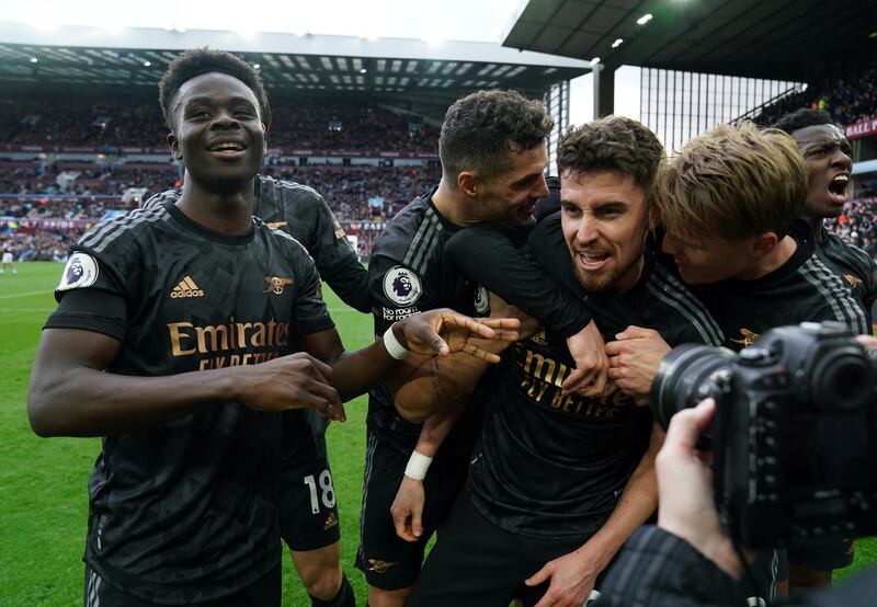 Jorginho celebrates Arsenal's third goal, an own goal by Aston Villa goalkeeper Emiliano Martinez, in their 4-2 Premier League win at Villa Park on February 18, 2023. PA