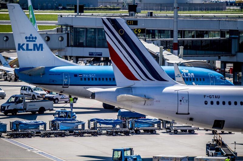 epa07749543 (FILE) - A general view shows Air France and KLM aircrafts at Schiphol Airport, The Netherlands, 07 May 2018 (reissued 31 July 2019). The Air France-KLM Group published its first half 2019 results on 31 July 2019, saying that it increased operating results to 400 million euro, up 54 million euro compared to last year, and improved passenger unit revenue as rising fuel prices were countered by cost-cutting. The group made also decisions on the renewal of its fleet for a more environmentally friendly operation, including the order of sixty Airbus A220s and the accelerated phasing out of ten Airbus A380, CEO Benjamin Smith added in the group's statement.  EPA/ROBIN UTRECHT *** Local Caption *** 54314956