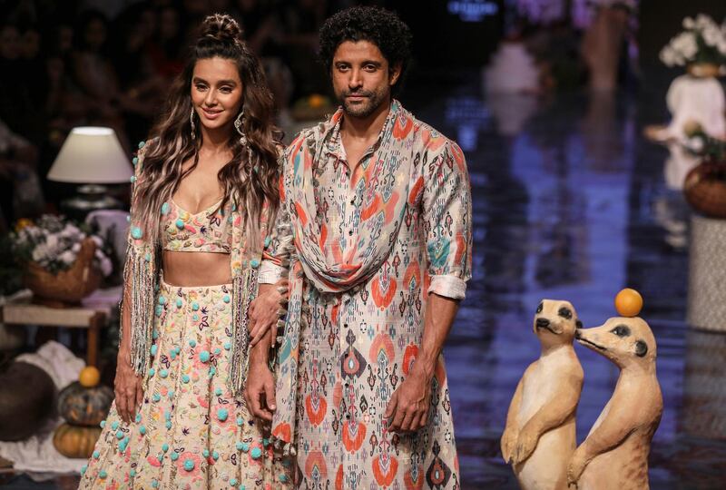 epa07784226 Bollywood celebrities Shibani Dandekar (L) and Farhan Akhtar (R) present creations by Indian designer Payal Singhal during the Lakme Fashion Week (LFW) Winter/Festive 2019 in Mumbai, India, 21 August 2019. More than 75 designers are showcasing their collections until 25 August.  EPA/DIVYAKANT SOLANKI