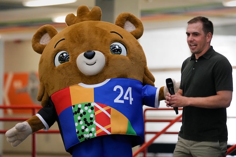 Tournament director Phillip Lahm presents the mascot for Euro 2024 in Gelsenkirchen. AP
