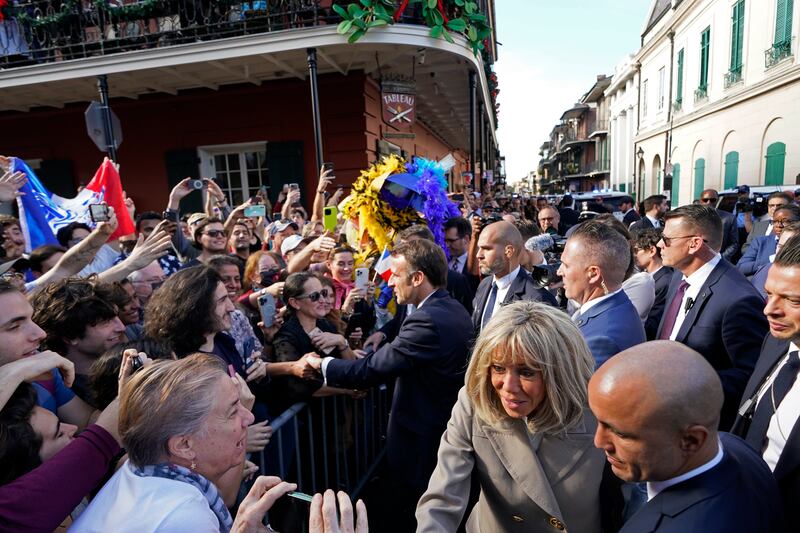 The French President and his wife were met by a sea of well-wishers. AP