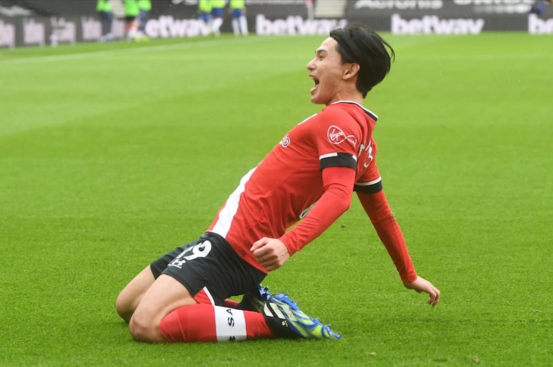 Southampton's Takumi Minamino celebrates after scoring his side's opening goal against Chelsea. AP