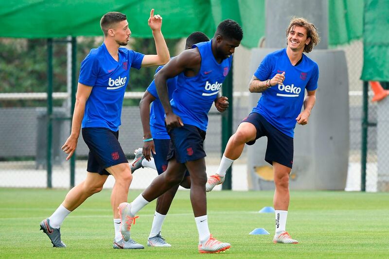 From left:  Clement Lenglet, Samuel Umtiti and Antoine Griezmann take part in pre-season training. AFP