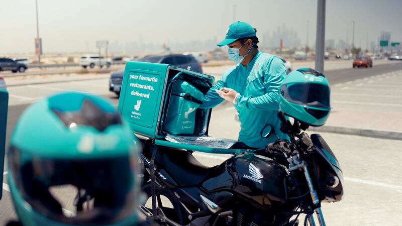 A Deliveroo rider prepares to make a delivery after collecting a meal at the company's dark kitchen in Dubai's Hessa Street. Courtesy: Deliveroo