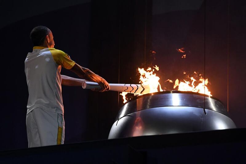 Former Brazilian athlete Vanderlei Cordeiro lights the Olympic flame during the opening ceremony of the Rio 2016 Olympic Games at the Maracana stadium in Rio de Janeiro. Jewel Samad / AFP