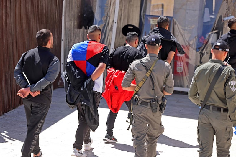 Palestinian youths who took part in a protest at the mosque are arrested by Israeli security forces. AFP
