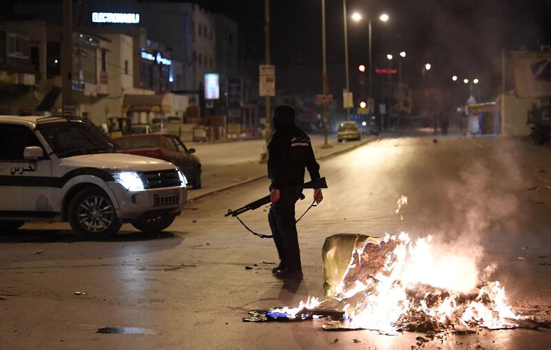 Tunisian security forces clash with protesters. Fethi Belaid / AFP Photo