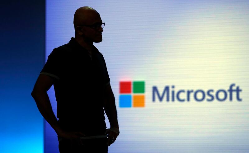 FILE - In this May 7, 2018, file photo, Microsoft CEO Satya Nadella looks on during a video as he delivers the keynote address at Build, the company's annual conference for software developers in Seattle. Microsoft says the coronavirus pandemic has increased demand for its flagship cloud computing and workplace productivity products as it reported quarterly earnings Wednesday, July 22, 2020, that beat Wall Street expectations. (AP Photo/Elaine Thompson, File)