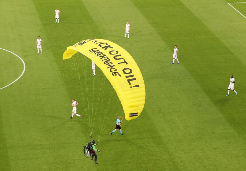 Soccer Football - Euro 2020 - Group F - France v Germany - Football Arena Munich, Munich, Germany - June 15, 2021 A Greenpeace protestor glides on to the pitch before the match Pool via REUTERS/Alexander Hassenstein     TPX IMAGES OF THE DAY