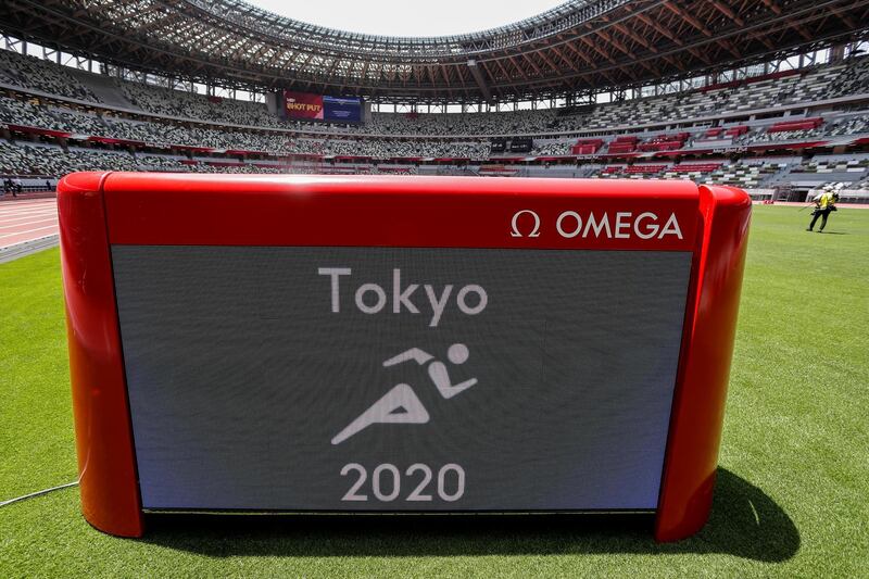 The Tokyo 2020 athletics pictogram is seen on an electronic display during the morning session of the athletics test event. Reuters