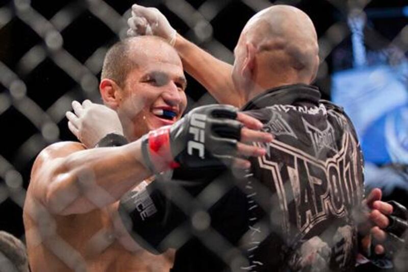 Junior Dos Santos, left, reacts after defeating Frank Mir by knockout in the second round during a UFC 146 heavyweight title bout, Saturday, May 26, 2012, in Las Vegas. (AP Photo/Julie Jacobson) 