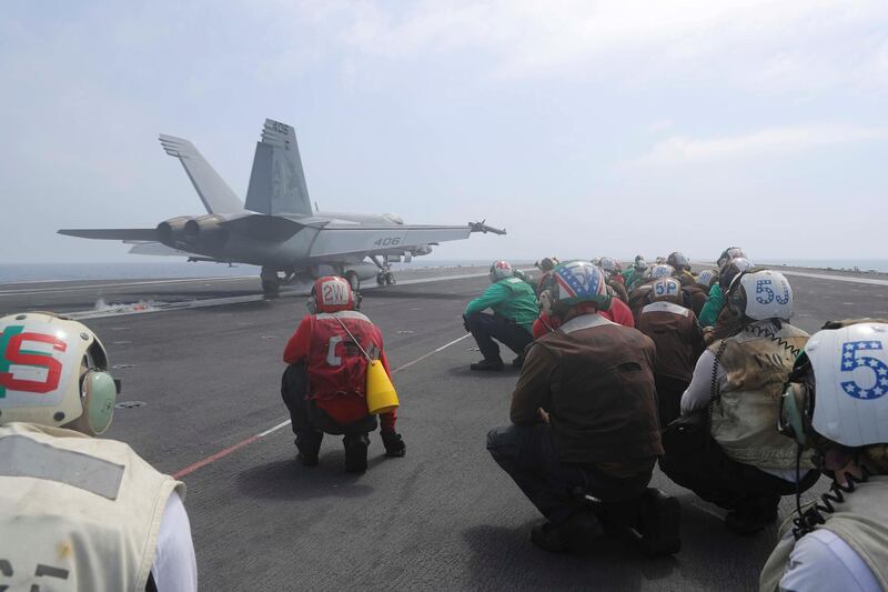 An F/A-18E Super Hornet from the "Fist of the Fleet" of Strike Fighter Squadron (VFA) 25 launches from the flight deck of the Nimitz-class aircraft carrier USS Abraham Lincoln (CVN 72) in the Arabian Sea.  Reuters