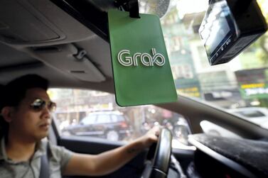 Backed by the likes of China's Didi Chuxing and Japan's MUFG, Singapore-based Grab is aiming to transform its business. REUTERS/Kham