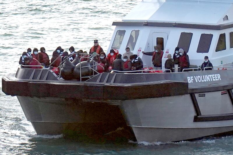 Migrants are taken to Dover, England, onboard a Border Force vessel after being found in the English Channel on Sunday. PA