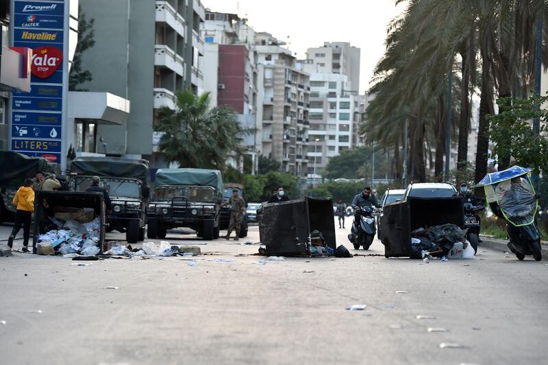 Anti-government protesters block a main road in Beirut. EPA