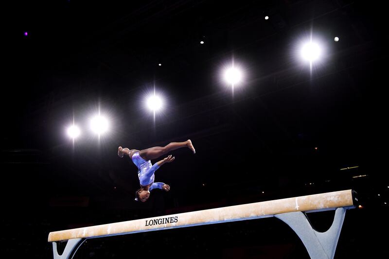 Simone Biles competes in women's balance beem final at the FIG Artistic Gymnastics World Championships in Stuttgart, on Sunday, October 13. The American won five golds in Germany and became the most decorated gymnast in World Championships history, with 25 medals. Getty