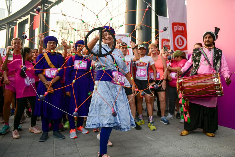 A dhol group performs before the 5km run at the Dubai Women's Run. 

