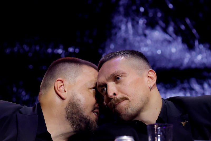 Oleksandr Usyk and promoter Alex Krassyuk during the press conference. Reuters 