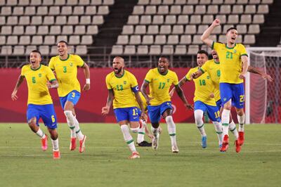 Dani Alves and his Brazil teammates celebrate after beating Mexico in the penalty shoot-out